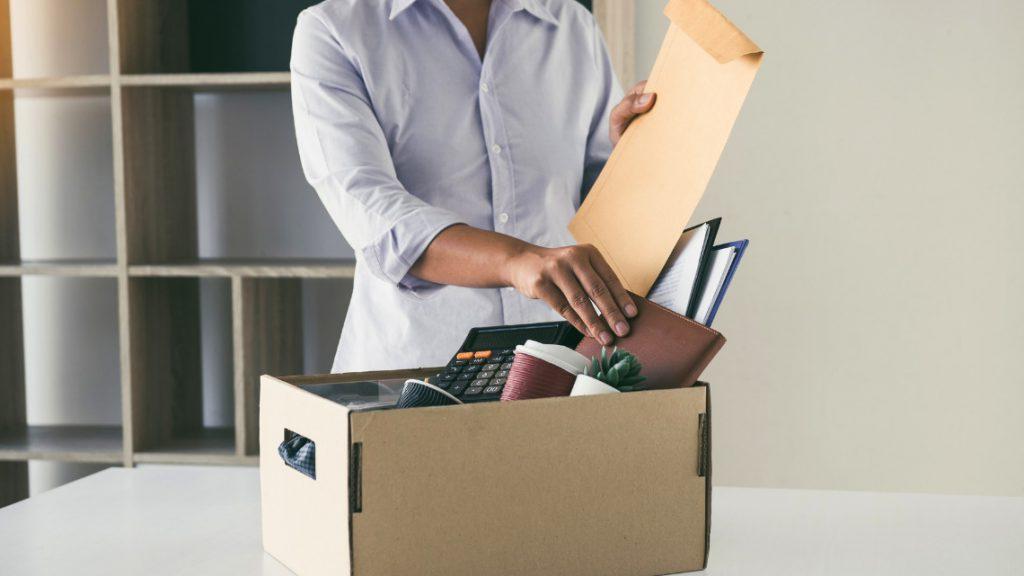 An employee quits, packs a box of belongings